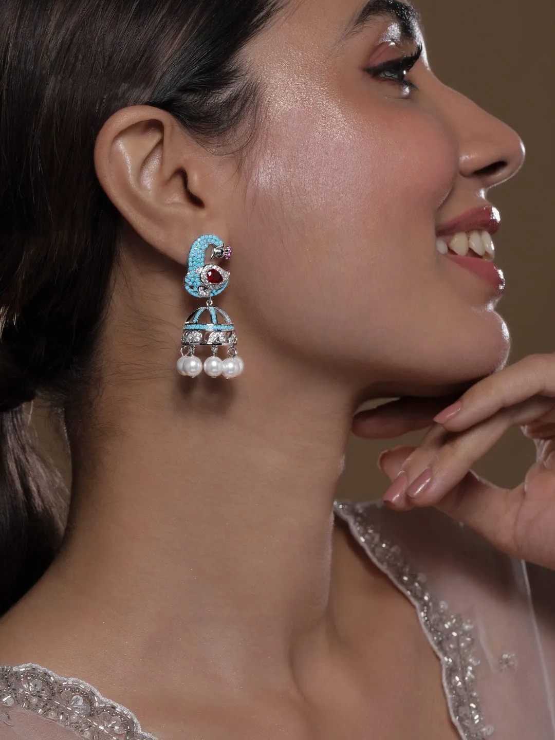 Rhodium-Plated Turquoise Blue & Ruby AD & Zirconia Studded Peacock Design Jhumka Earrings